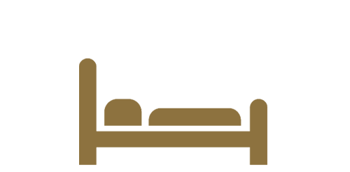 Goldfarbenes Symbol eines Bettes mit Kissen und Matratze als Hinweis auf Übernachtung oder Hotelzimmer.